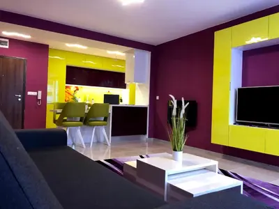 a living room with a couch and a table at Ultraviolet relax apart in Sofia