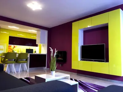a living room with yellow and purple walls and a tv at Ultraviolet relax apart in Sofia