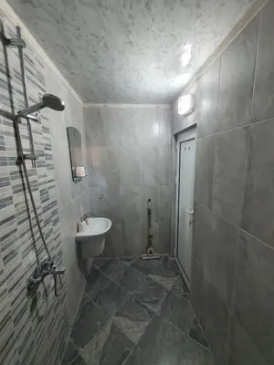 a bathroom with a sink and a toilet at Дамяновата къща in Sapareva Banya