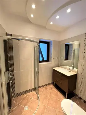 a bathroom with a shower and a sink at Комплекс Орлово гнездо in Beli Iskar