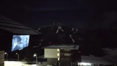 a night time view of a building and a tv at Pearl XL in Pamporovo