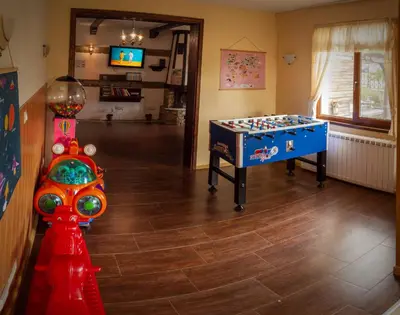 a room with a foosball table and a game at Апартамент в MountainLake in Smolyan