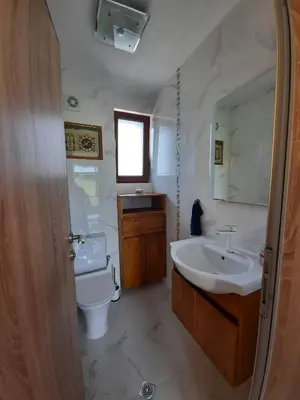 a bathroom with a sink and a toilet at Mountain Villa near Bansko in Razlog