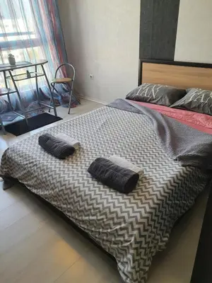 a large bed with two pillows on top of it at Nights apartment in Sofia