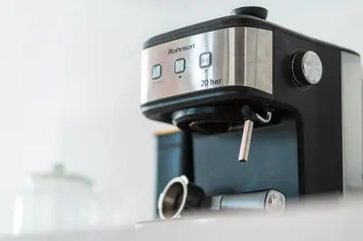 a coffee machine sitting on top of a counter at Vertigo Modern 2-Bedroom Apartment with Parking & Vitosha View in Sofia