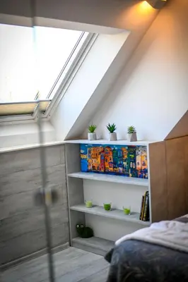 a room with stairs with plants on shelves at Cloud 6 -Top Center,360° view,Free private parking in Plovdiv