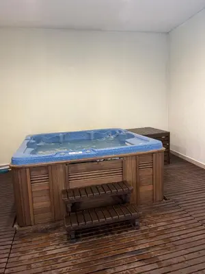 a large jacuzzi tub in a room at Bansko SPA Studio at Predela1 in Bansko