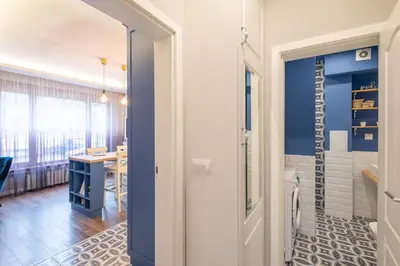 a hallway with a door leading to a dining room at Designer & Cozy 2BD Flat with a parking in the city center by Flat Mаnager in Sofia