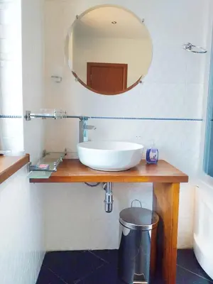 a bathroom with a white sink and a mirror at Стаи за Гости Lavender Lozen in Lozen