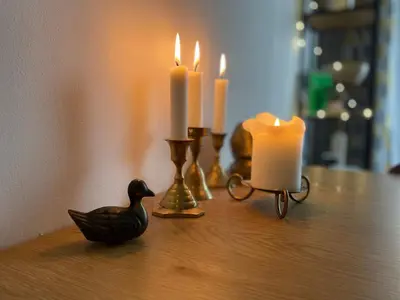 a table with candles and a duck and a candle holder at Lovely 2-bedroom serviced apartment with SPA in Bansko