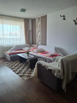 a living room with a bed and a couch at Илен 433 Bansko Royal Towers in Bansko
