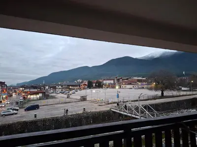 a view of a parking lot with mountains in the background at Илен 433 Bansko Royal Towers in Bansko