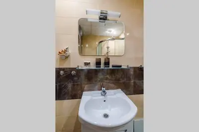 a bathroom with a sink and a mirror at New & Comfortable home in Blagoevgrad center in Blagoevgrad