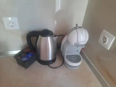 a coffee maker and a blender in a corner at Апартамент Адиз 2 in Sandanski