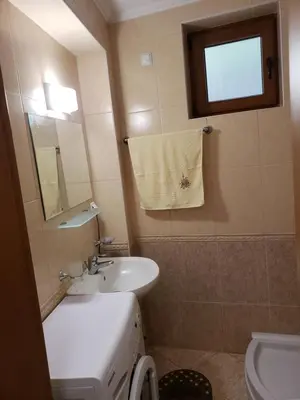 a bathroom with a sink and a toilet and a mirror at Ski-in ski-out Studio 2A7 Grand Monastery in Pamporovo