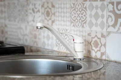 a sink with a faucet in a bathroom at Funky apartment in Studentski Grad in Sofia