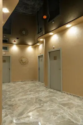 an empty room with two doors and a ceiling at Hotel CITY Petrich in Petrich