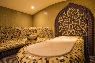 a bathroom with a bench and a tub in a room at Studio by Mountain Lakes in Ezerovo