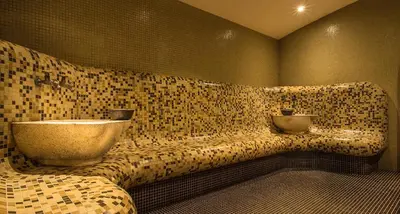 a bathroom with a sink on a tiled wall at Studio by Mountain Lakes in Ezerovo