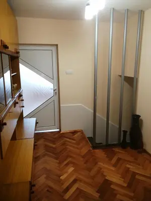 a room with a glass door and a wooden floor at дом Тодор и Тота Мутевски in Troyan