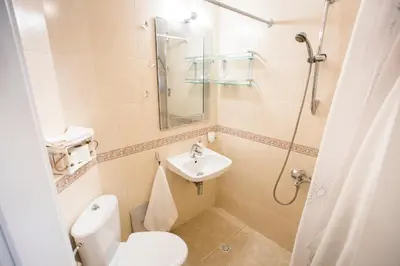 a small bathroom with a toilet and a sink at TOP CENTER Designer studio 1 minute to NDK&Vitosha by Flat Mаnager in Sofia