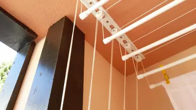 a bunch of strings hanging from a ceiling at Парк Апартаменти Юлия in Sandanski