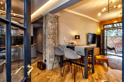 a kitchen and living room with a table and chairs at COURTHOUSE #4 EXCLUSIVE Top Center PRIVATE GARDEN in Sofia