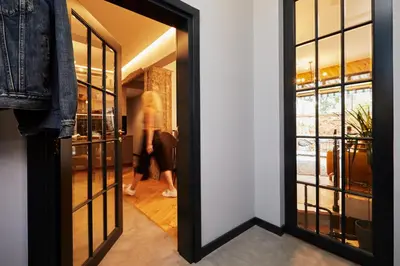 a woman walking into a dressing room with a glass door at COURTHOUSE #4 EXCLUSIVE Top Center PRIVATE GARDEN in Sofia