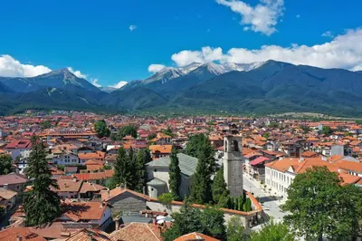 a view of a city with mountains in the background at Family apartment VYANI in Bansko