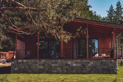 a house built on a brick wall at Dakota forest retreat in Tsigov Chark