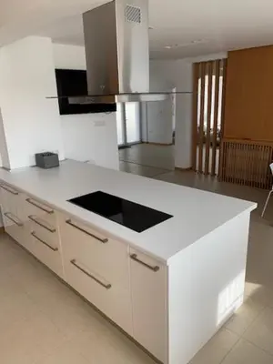 a kitchen with a white counter top in a room at Луксозна вила - Стрелча, джакузи с минерална вода in Strelcha