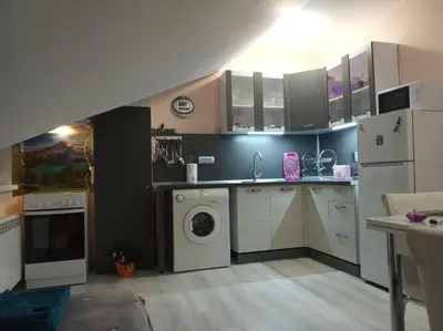 a kitchen with a washing machine and a washer at IGLIKA 2 SNOWY NIGHT V 31 in Borovets