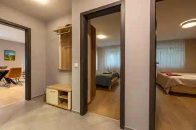 a room with a door leading to a bedroom at Apartment City Home in Sofia