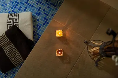 an overhead view of a bathroom with two candles at Hotel Astrea in Hisarya