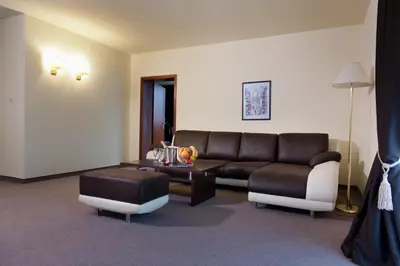a living room with a couch and a table at Hotel Astrea in Hisarya