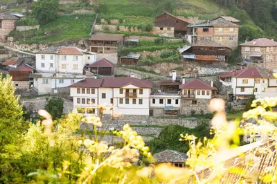 a village on a hill with houses on it at Villa Zaburdo in Zabŭrdo