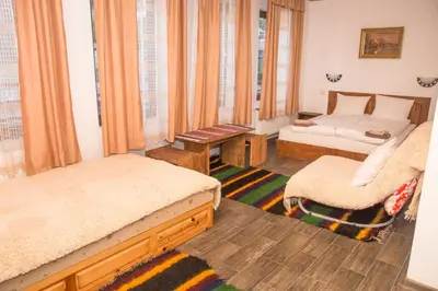 a living room with two beds and a couch at Villa Zaburdo in Zabŭrdo