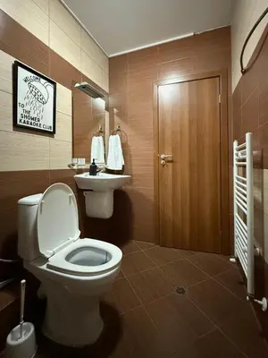 a bathroom with a toilet and a sink at Green life Bansko, 1 bedroom private apartment D4 in Bansko