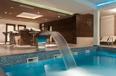 a swimming pool with a water slide in a hotel at Green life Bansko, 1 bedroom private apartment D4 in Bansko