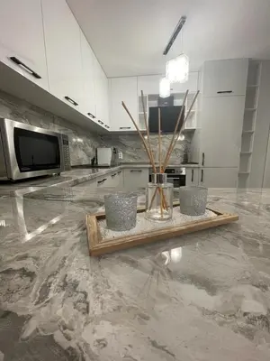 a kitchen with a counter with a table in it at Emily & Nasi in Plovdiv
