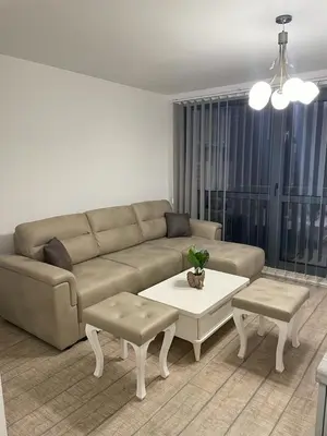 a living room with a couch and a table at Emily & Nasi in Plovdiv