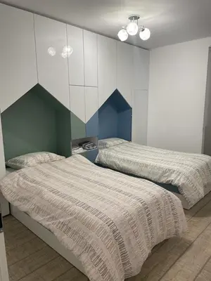 a bedroom with two beds in a room at Emily & Nasi in Plovdiv