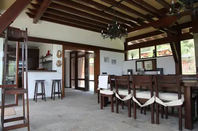 a dining room with a table and chairs at Kameno in Banya