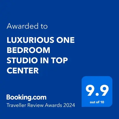 a blue sign with the text awarded to luxurious one bedroom studio in top center at LUXURIOUS ONE BEDROOM STUDIO IN TOP CENTER in Blagoevgrad