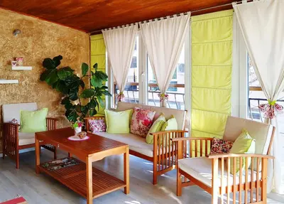 a living room with a couch and chairs and a table at Apartment Nicole in Plovdiv