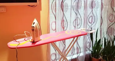 a pink desk with a computer on top of it at Apartment Nicole in Plovdiv