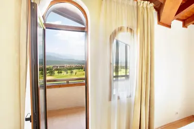 a room with a window with a view at Mountain View Pirin Golf in Bansko