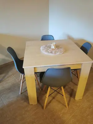 a table with chairs and a bowl on top of it at Na planina in Razlog