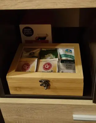 a wooden box with some food in a drawer at The Green King in Borovets