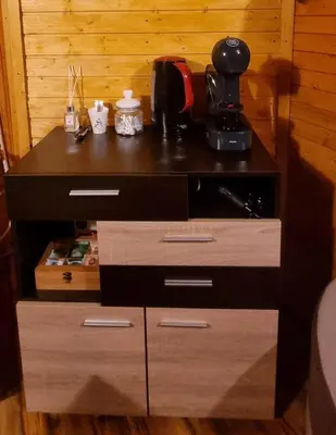 a table with a coffee maker on top of it at The Green King in Borovets